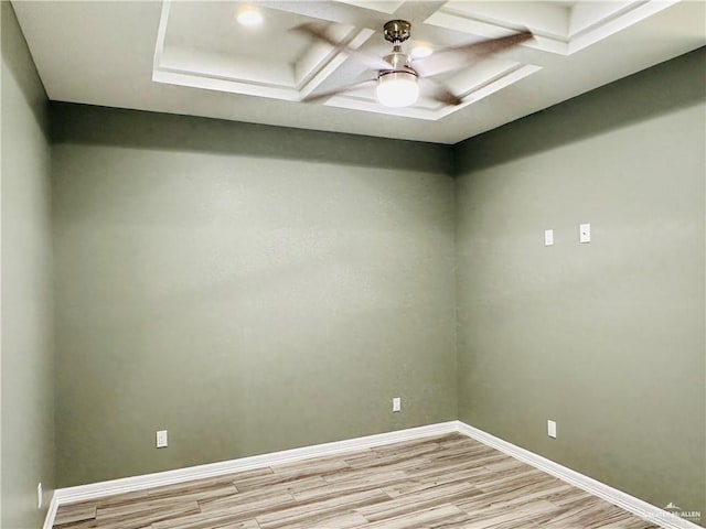 empty room featuring light wood-style floors, ceiling fan, and baseboards