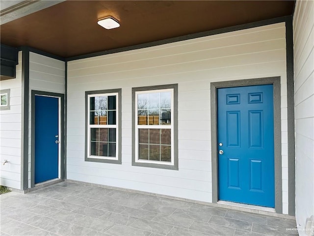 property entrance featuring covered porch