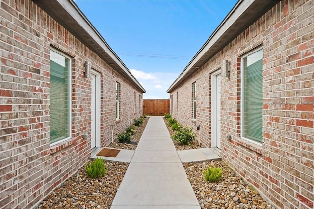 view of side of home with a patio area