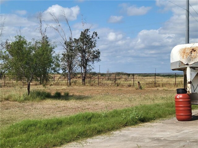 view of yard with a rural view