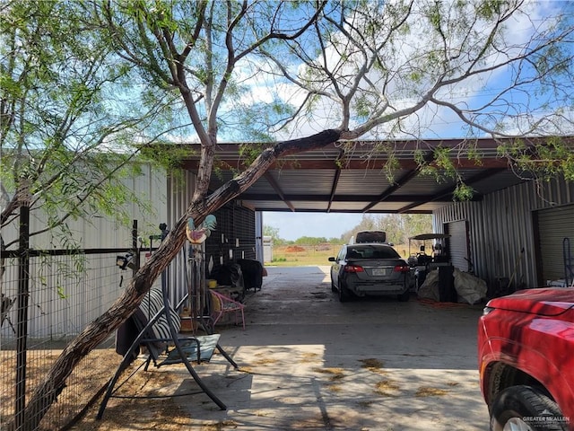 view of vehicle parking featuring a carport