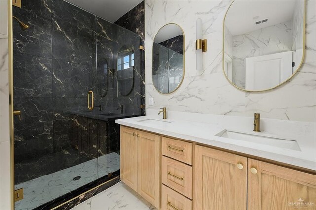 2717 E Versace Dr, Edinburg, TX 78542 - bathroom featuring marble tiled flooring, a marble finish shower, double vanity, and tile walls