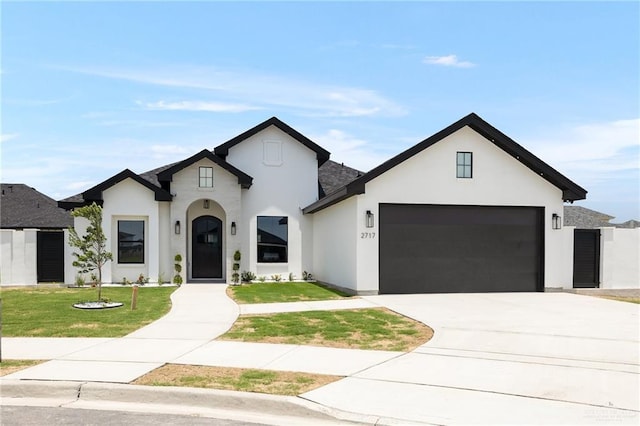 2717 E Versace Dr, Edinburg, TX 78542 - french country inspired facade featuring stucco siding, a front lawn, and an attached garage