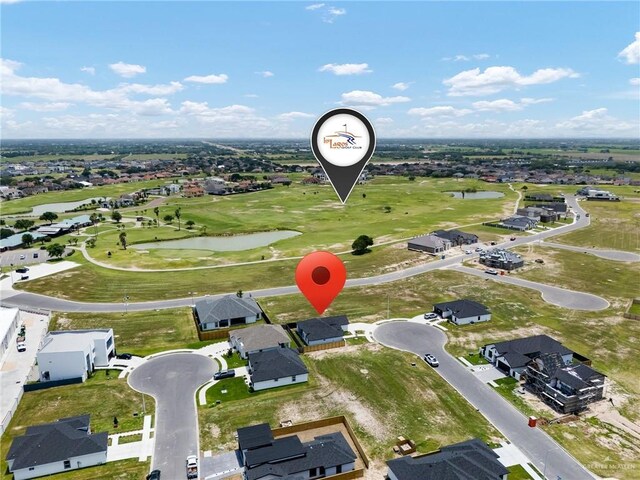 2717 E Versace Dr, Edinburg, TX 78542 - aerial overview of property's location featuring a large body of water, a golf course, and nearby suburban area