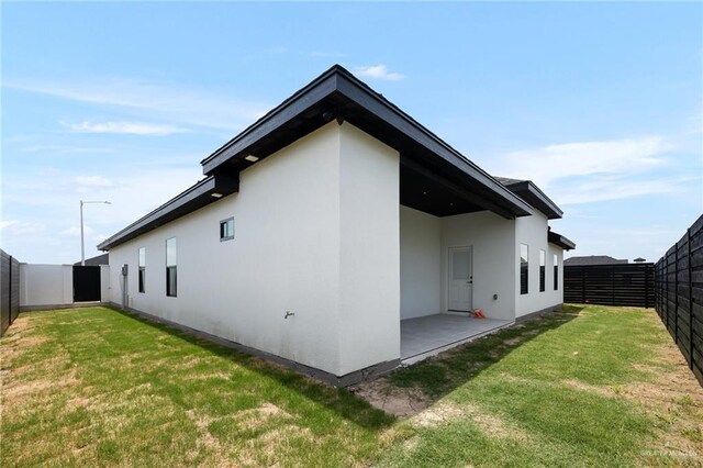 2717 E Versace Dr, Edinburg, TX 78542 - view of property exterior with stucco siding and a patio