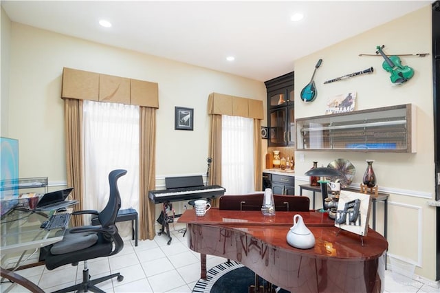 home office with a healthy amount of sunlight, light tile patterned floors, and recessed lighting