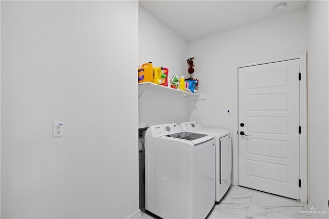 laundry room with laundry area, marble finish floor, baseboards, and separate washer and dryer