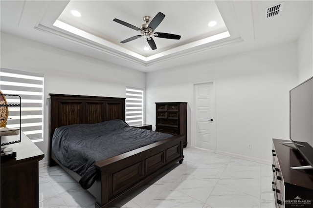 bedroom featuring recessed lighting, visible vents, baseboards, marble finish floor, and a raised ceiling