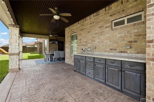 13410 N 36th Ln, Edinburg, TX 78541 - view of patio / terrace featuring area for grilling, ceiling fan, a playground, and outdoor dining space