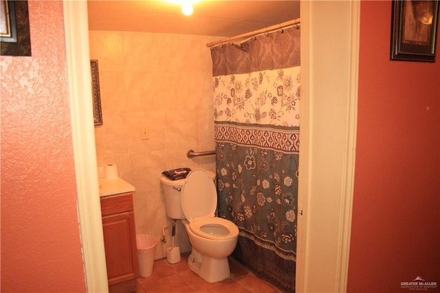 bathroom featuring tile patterned flooring, vanity, and toilet