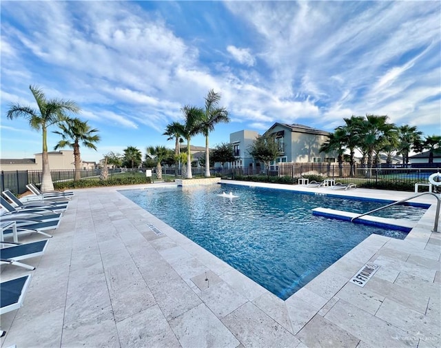 view of pool featuring a patio