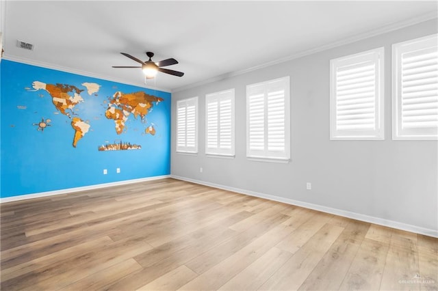 unfurnished room featuring ceiling fan, crown molding, and light hardwood / wood-style flooring