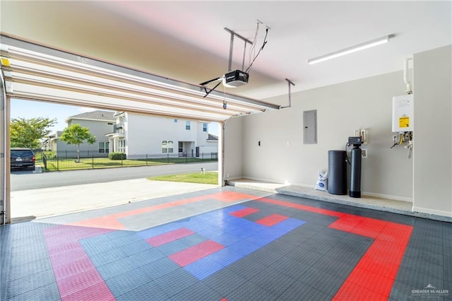 garage with water heater, a garage door opener, and electric panel