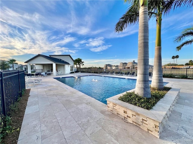 view of swimming pool with a patio