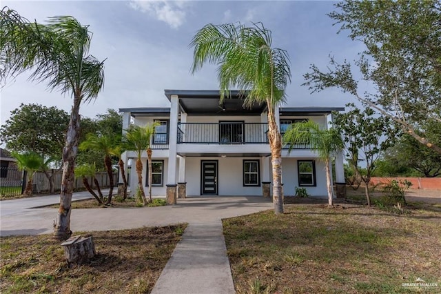 view of front of home with a balcony