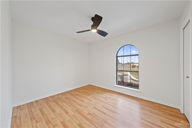 empty room featuring ceiling fan and light wood-type flooring