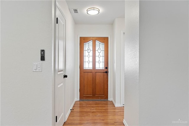 doorway to outside with light hardwood / wood-style flooring