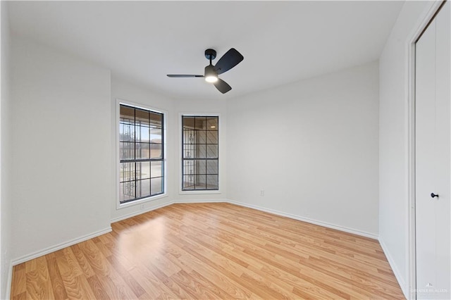 empty room with light hardwood / wood-style floors and ceiling fan