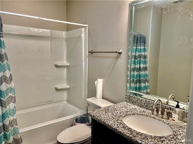 full bathroom featuring shower / bath combination with curtain, vanity, and toilet