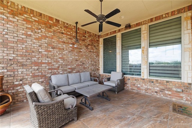 view of patio / terrace with an outdoor living space and ceiling fan