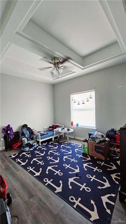 bedroom featuring dark hardwood / wood-style flooring and ceiling fan