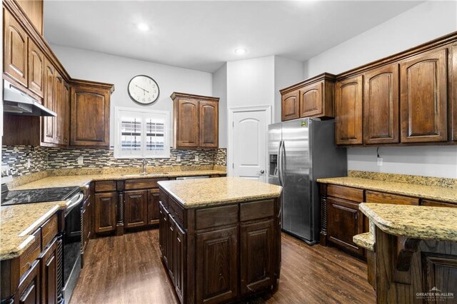 interior space featuring butcher block countertops, dark brown cabinetry, dark wood-type flooring, and a chandelier