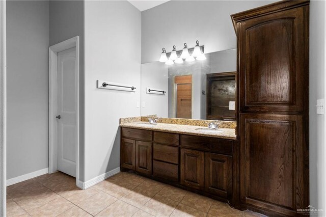 full bathroom featuring tile patterned flooring, vanity, tiled shower / bath combo, and toilet