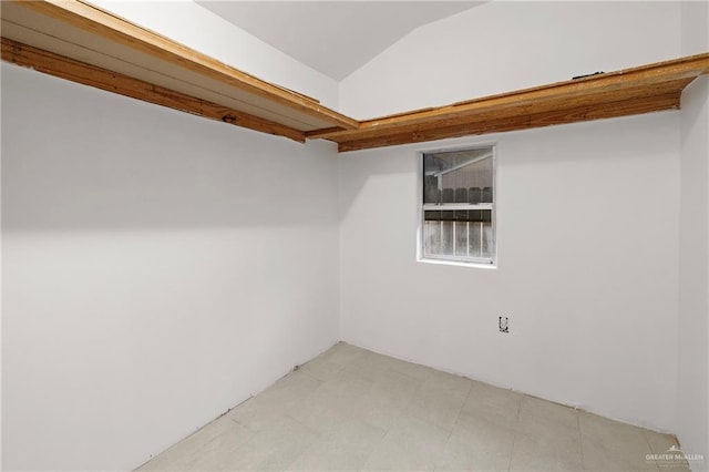 walk in closet featuring vaulted ceiling