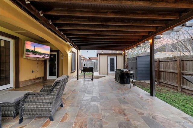 view of patio with a shed