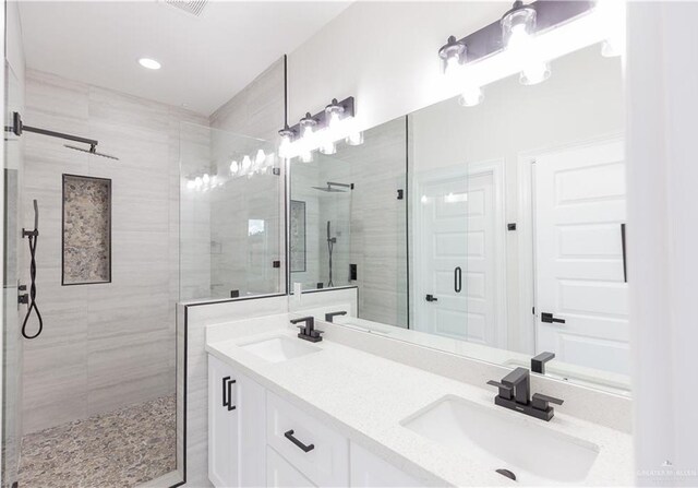 bathroom with vanity and an enclosed shower