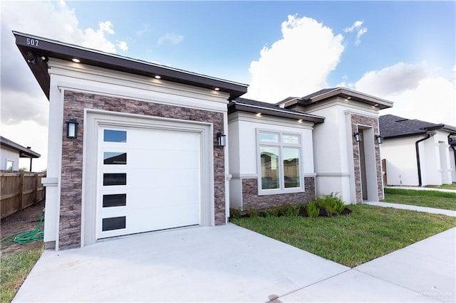 view of front facade featuring a front lawn and a garage