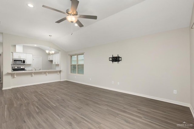 14222 Chalk Ridge Dr, Mcallen, TX 78504 - unfurnished living room featuring dark wood-style flooring, vaulted ceiling, a chandelier, recessed lighting, and ceiling fan