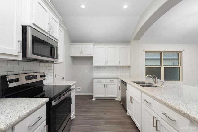 14222 Chalk Ridge Dr, Mcallen, TX 78504 - kitchen featuring appliances with stainless steel finishes, a sink, white cabinets, dark wood-type flooring, and recessed lighting