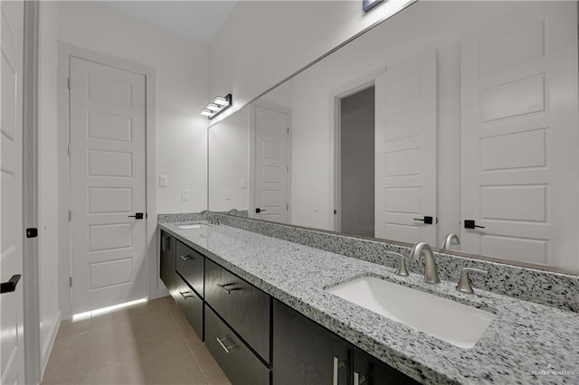 bathroom featuring tile patterned flooring and vanity