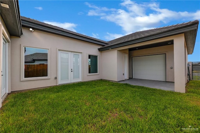 view of front facade with french doors and a front yard