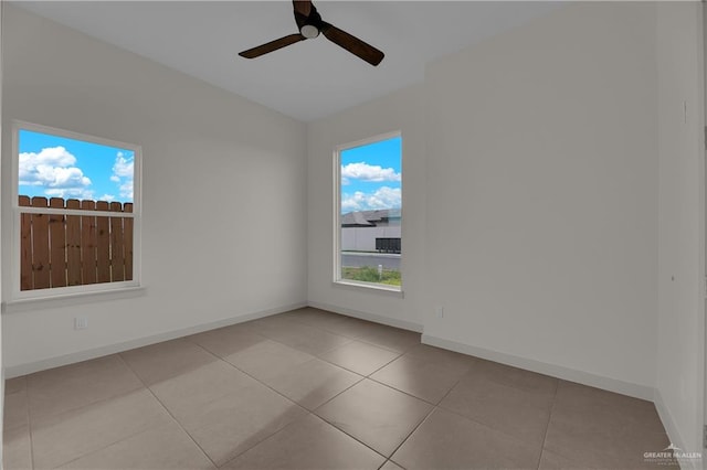 tiled empty room with ceiling fan