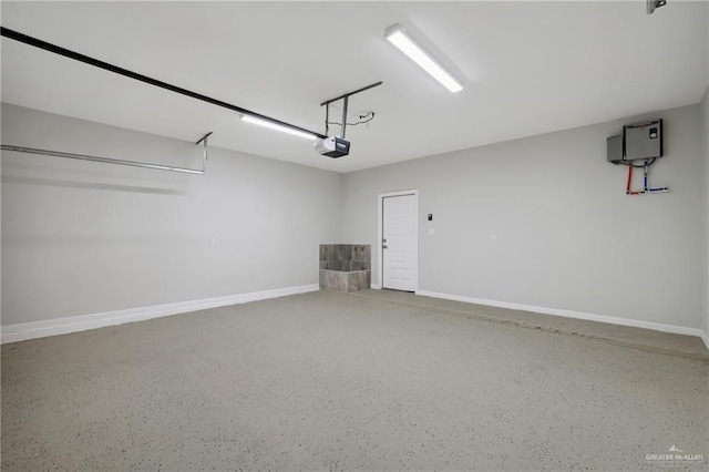 garage featuring baseboards and a garage door opener