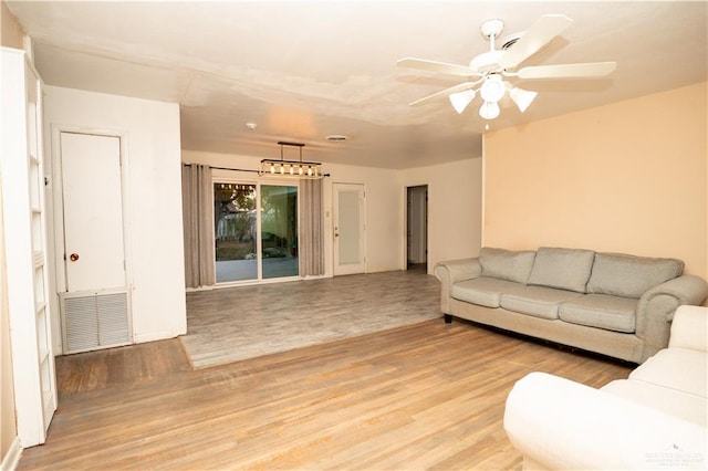 living room featuring ceiling fan and light hardwood / wood-style flooring