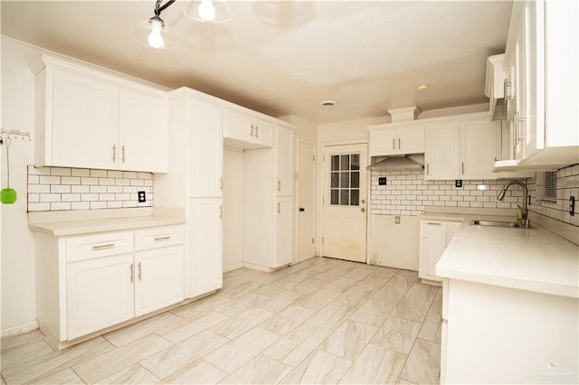 kitchen with sink and white cabinets