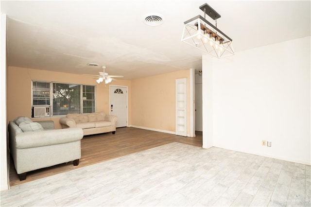 unfurnished living room featuring light hardwood / wood-style floors and ceiling fan