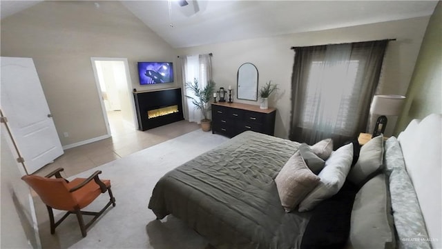 4919 Crown Point St, Edinburg, TX 78541 - bedroom with a glass covered fireplace, lofted ceiling, baseboards, a ceiling fan, and light tile patterned flooring