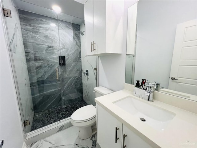 bathroom with vanity, toilet, and an enclosed shower