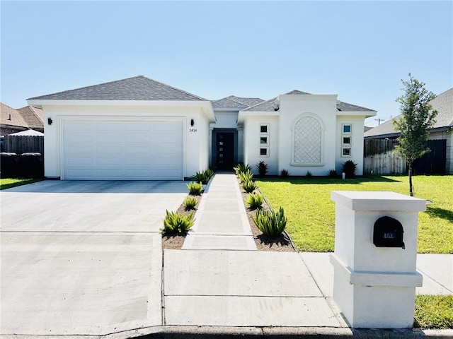 view of front of house with a garage and a front lawn