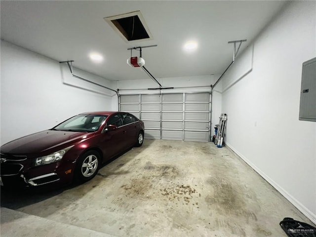 garage featuring electric panel and a garage door opener