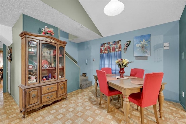 7027 Jo Din St, Edinburg, TX 78542 - dining area featuring lofted ceiling, light floors, and stairway