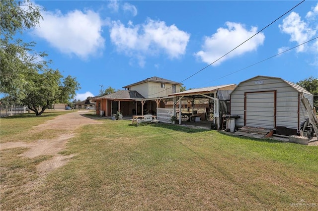7027 Jo Din St, Edinburg, TX 78542 - rear view of house featuring a lawn