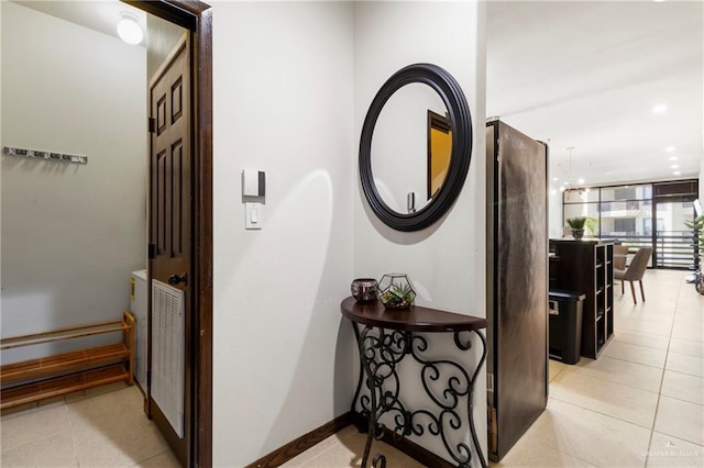 813 Travis St Unit 214, Mission, TX 78572 - hallway featuring light tile patterned flooring and baseboards