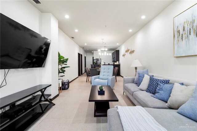 813 Travis St Unit 214, Mission, TX 78572 - living room with a chandelier, recessed lighting, and baseboards