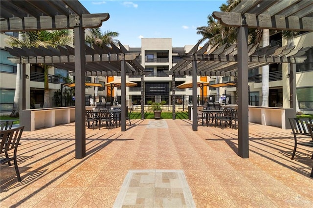 813 Travis St Unit 214, Mission, TX 78572 - view of property's community with a pergola