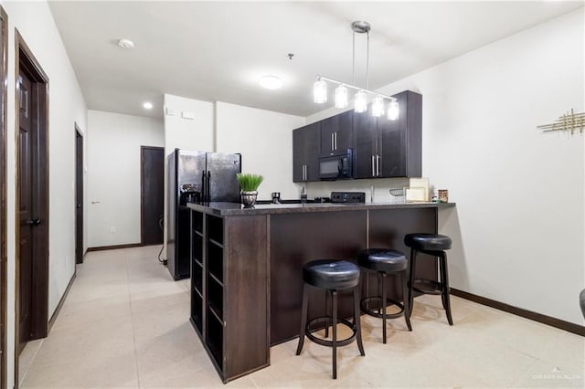 813 Travis St Unit 214, Mission, TX 78572 - kitchen with black appliances, open shelves, a peninsula, a breakfast bar, and baseboards